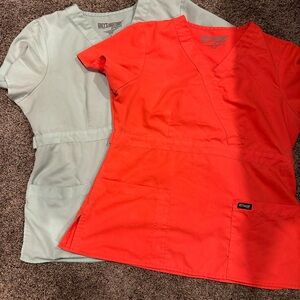 Two large Grey’s Anatomy scrub tops